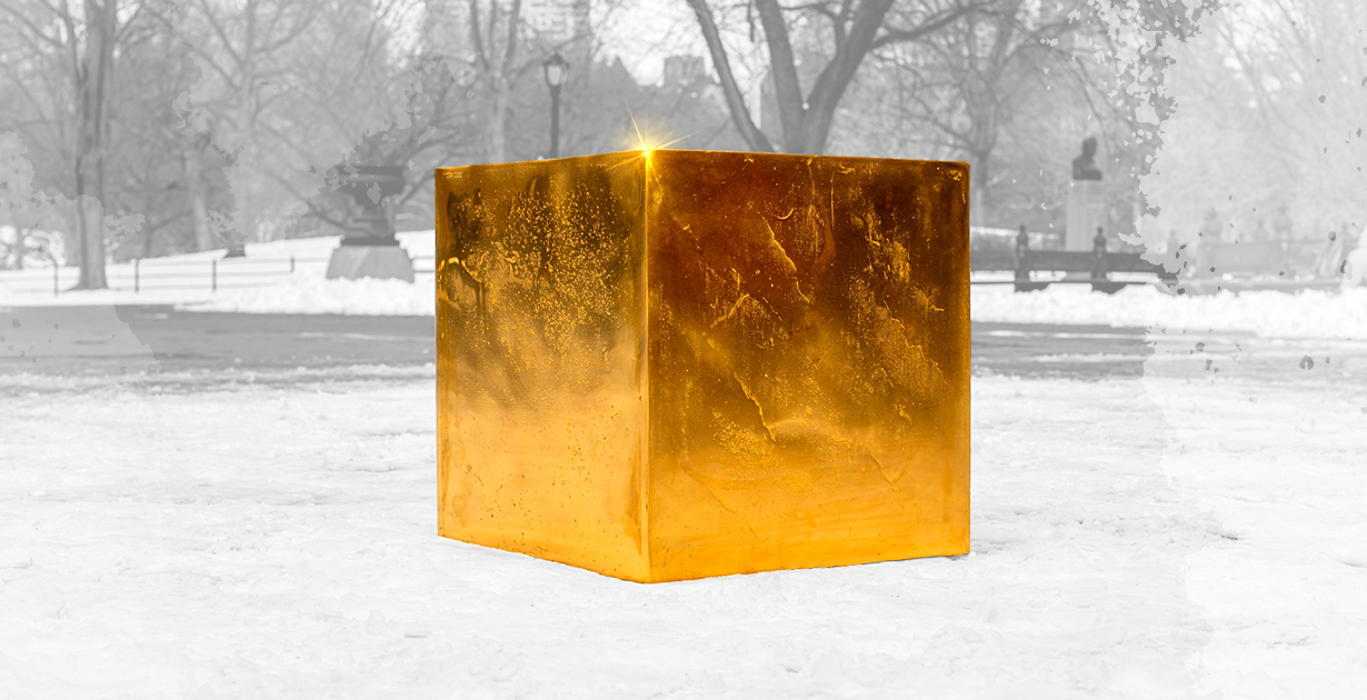 Golden cube in the middle of the park